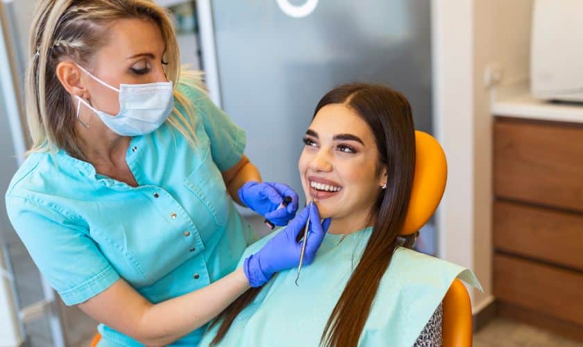 Dentist doing teeth whitening treatment
