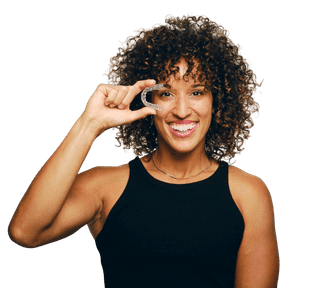 Woman making phone call gesture, smiling against white background for dental practice website.